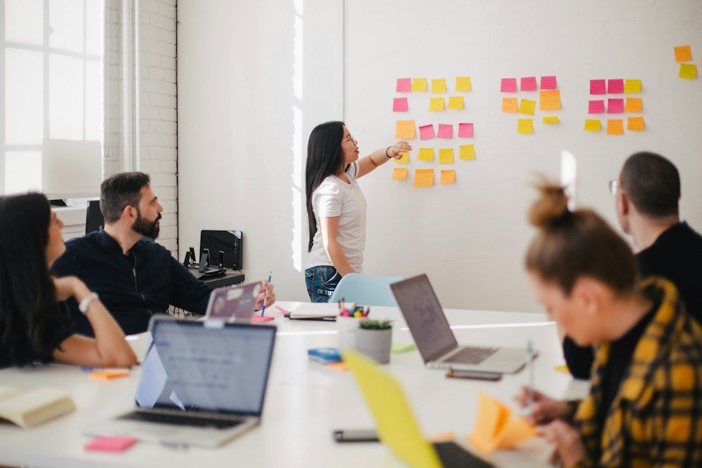 Team reviewing marketing ideas on sticky notes